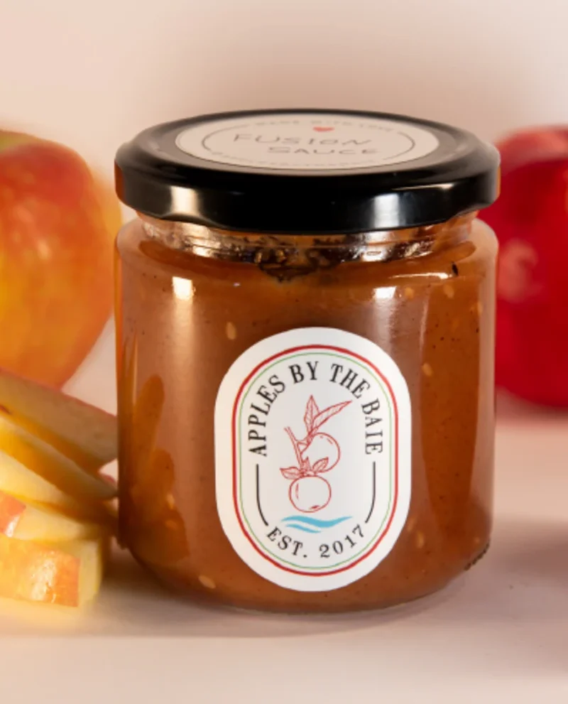 Jar of apple fusion dipping sauce with sliced apples